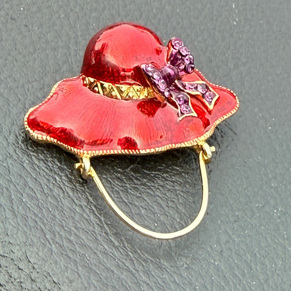 Source Unknown Red Enamel Hat Brooch with Purple Bow and Gold Trim